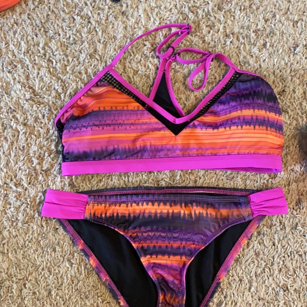 Oakley swimming suit, size SM, never worn